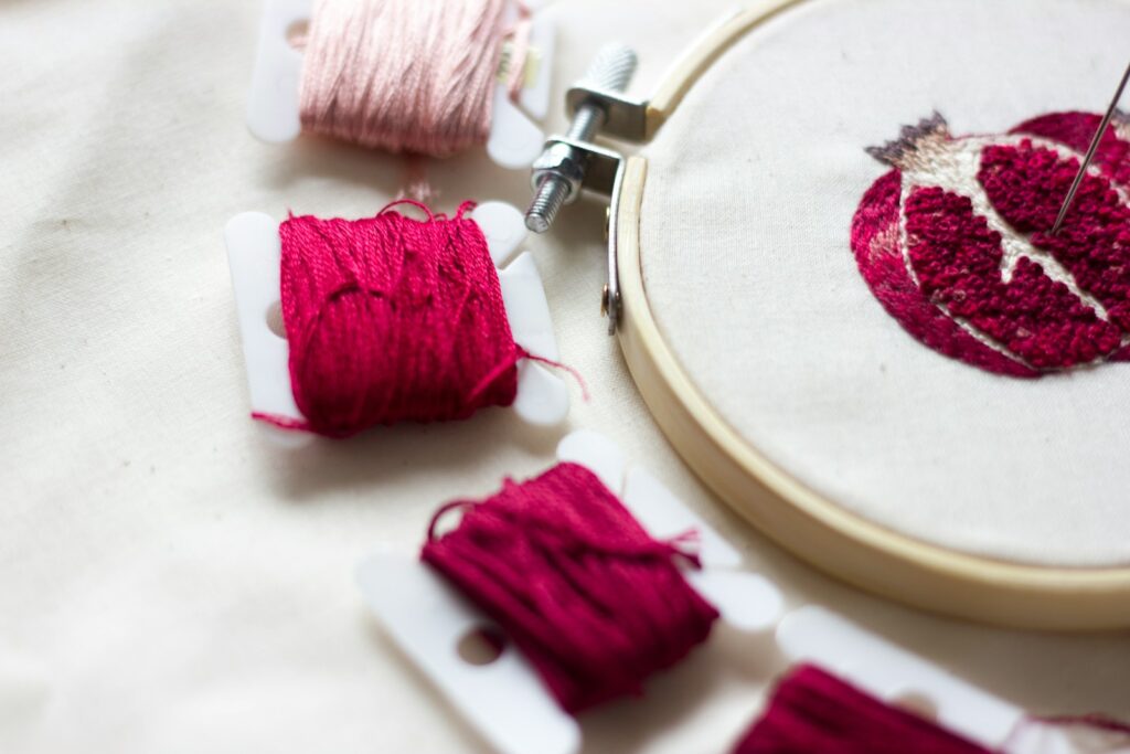 pink thread on white round plate